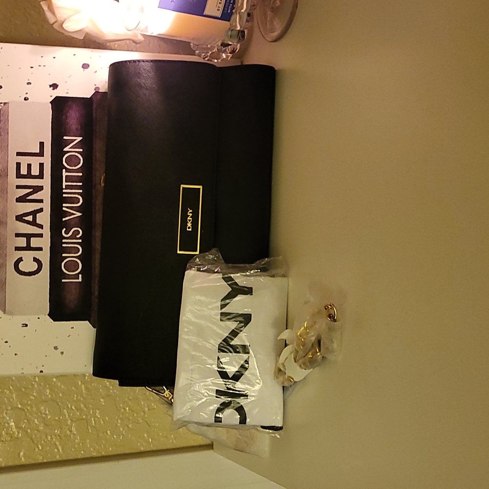 NWOT/still wrapped DKNY crossbody bag, black faux leather and gold hardware